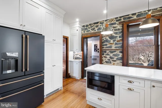a kitchen with a refrigerator and countertop