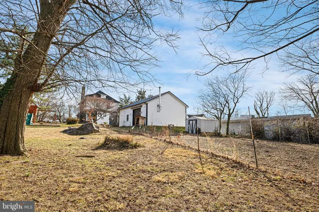 a house that has a tree in front of it