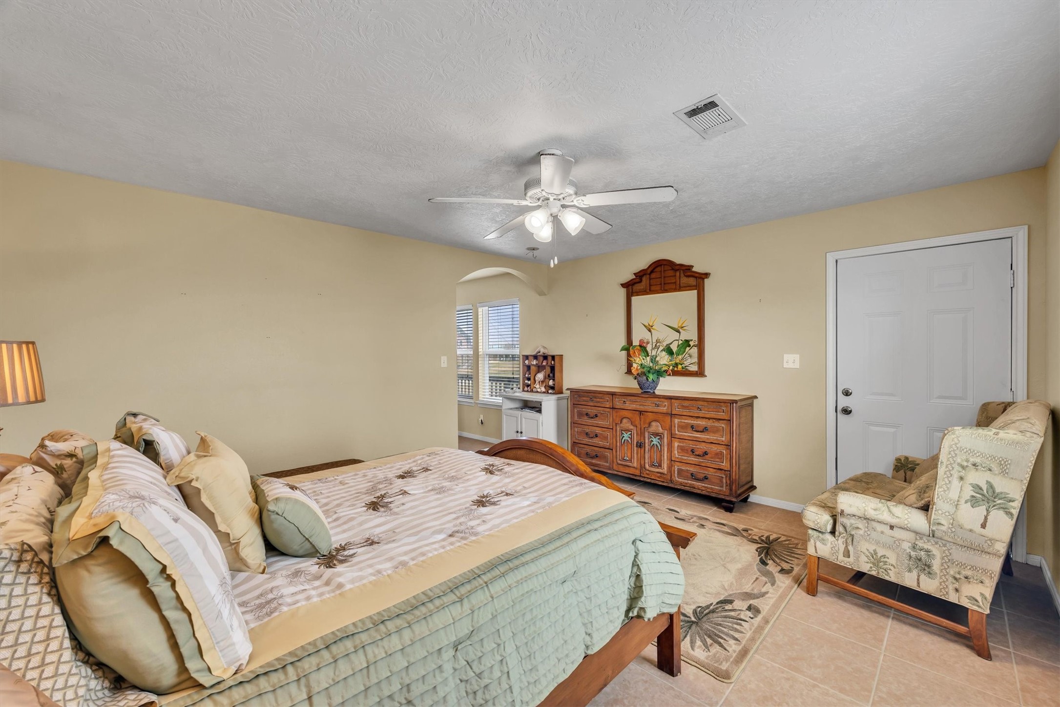 818 Seashell Drive Freeport, TX 77541 - Photo 14 of 23 a bedroom with a bed and ceiling fan