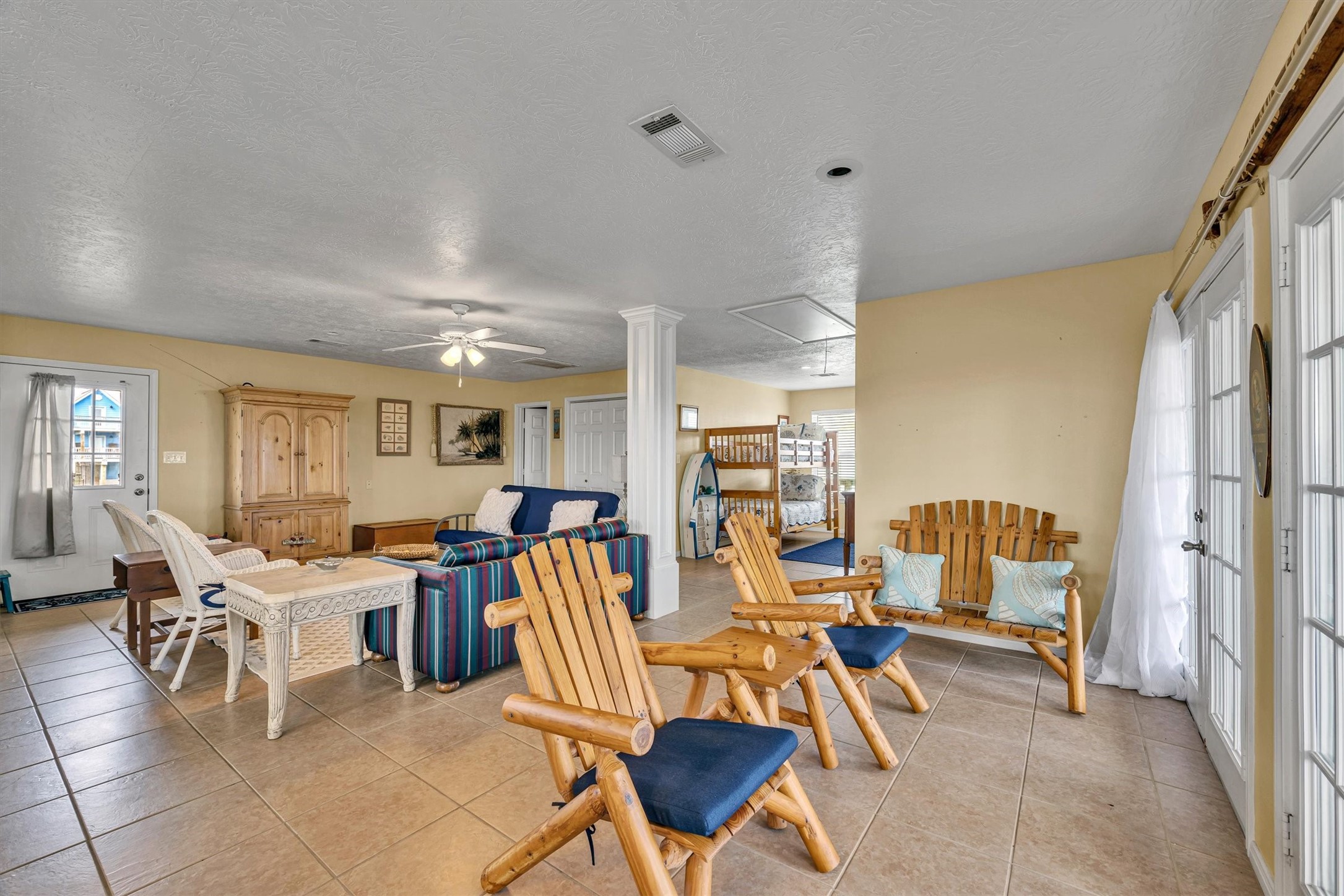 818 Seashell Drive Freeport, TX 77541 - Photo 22 of 23 a living room with lots of furniture and a large window