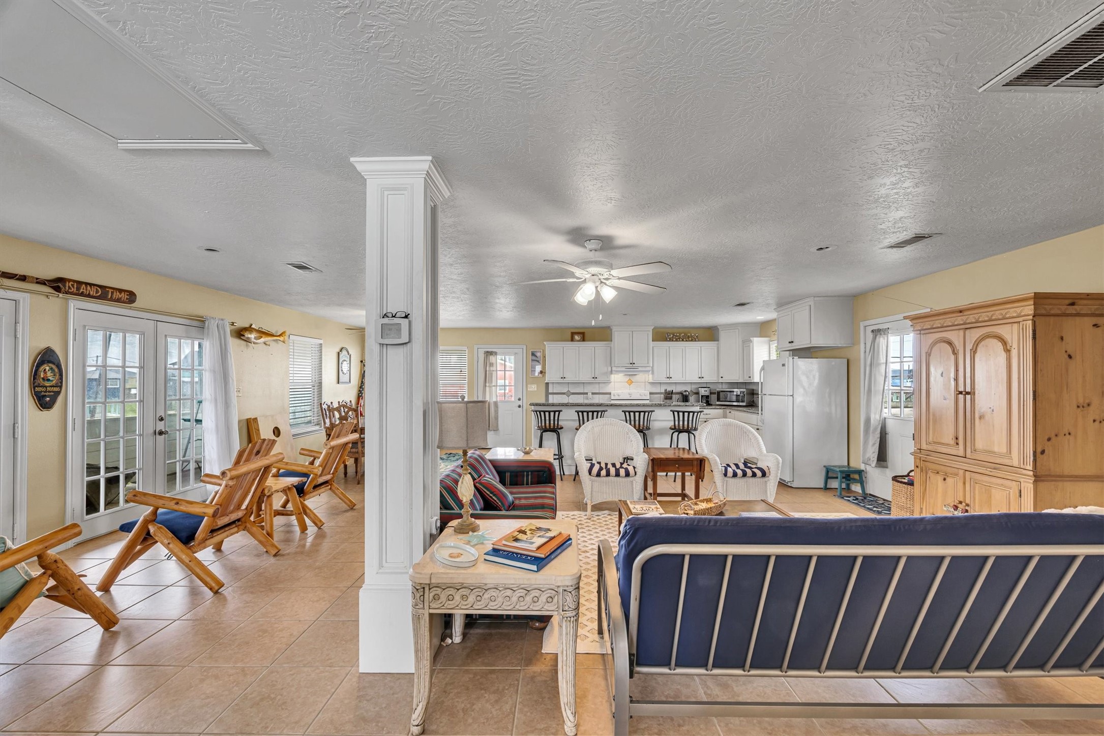 818 Seashell Drive Freeport, TX 77541 - Photo 4 of 23 a living room with furniture kitchen view and a large window