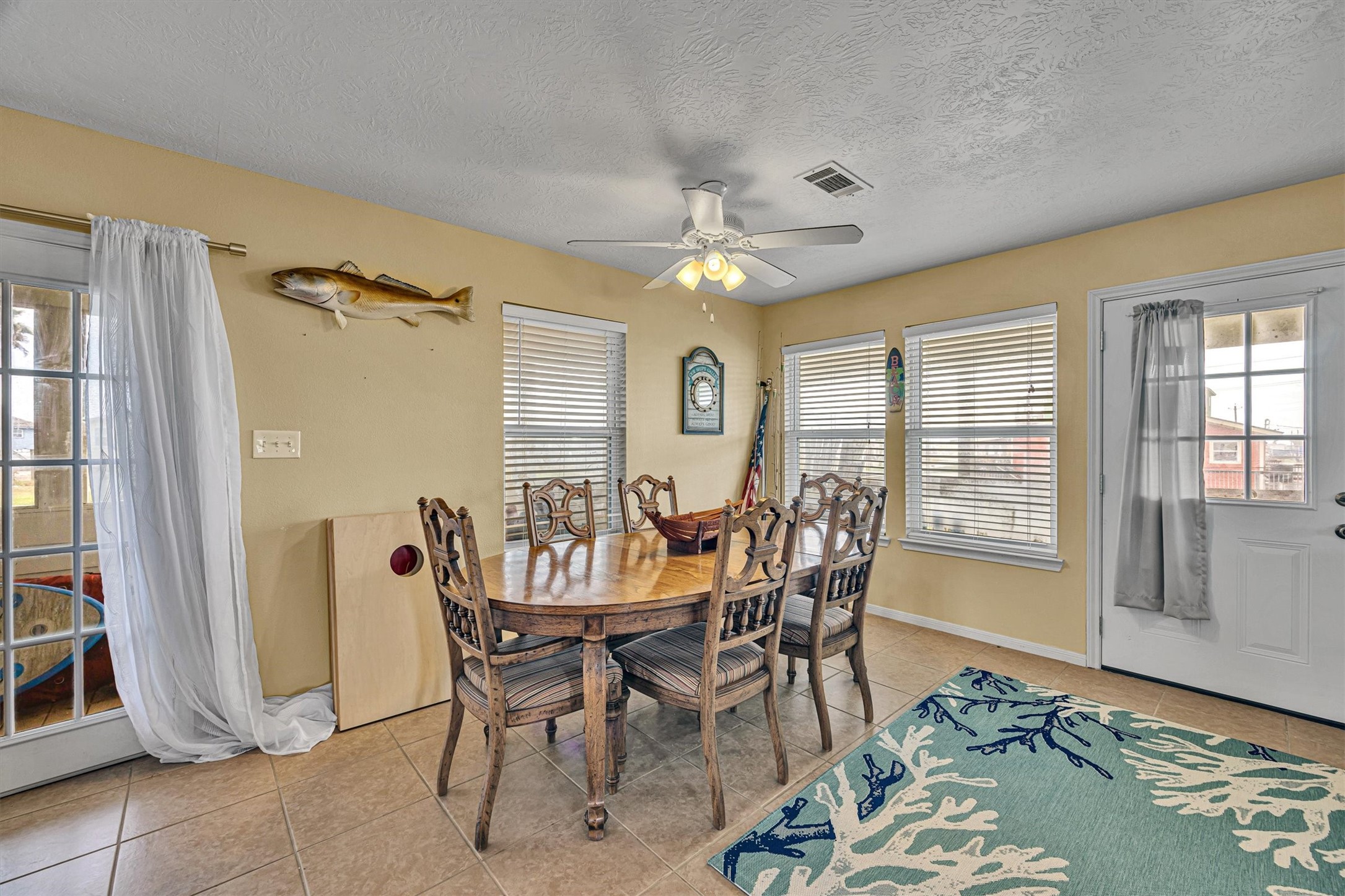 818 Seashell Drive Freeport, TX 77541 - Photo 6 of 23 a view of a dining room with furniture window and wooden floor