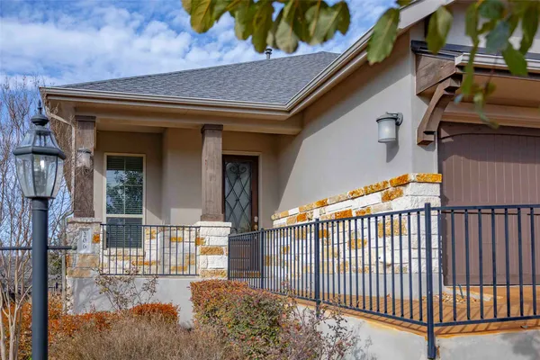 a view of a patio with a table and chairs