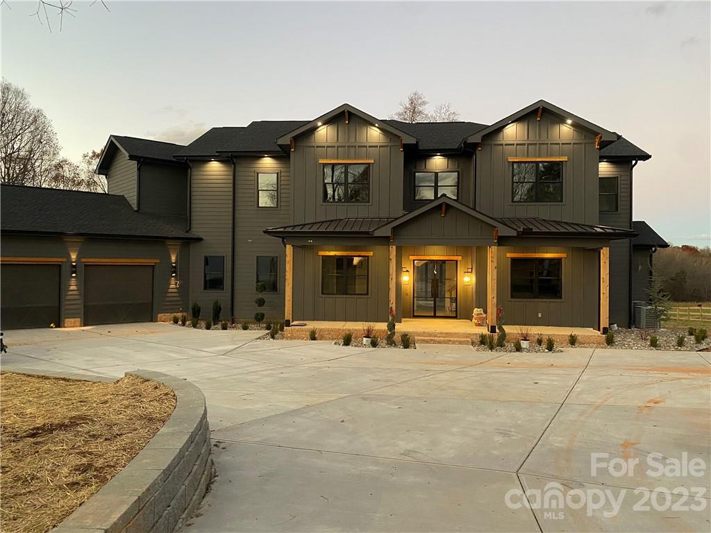 725 Houston Road Troutman, NC 28166 - Photo 1 of 2 a front view of a house