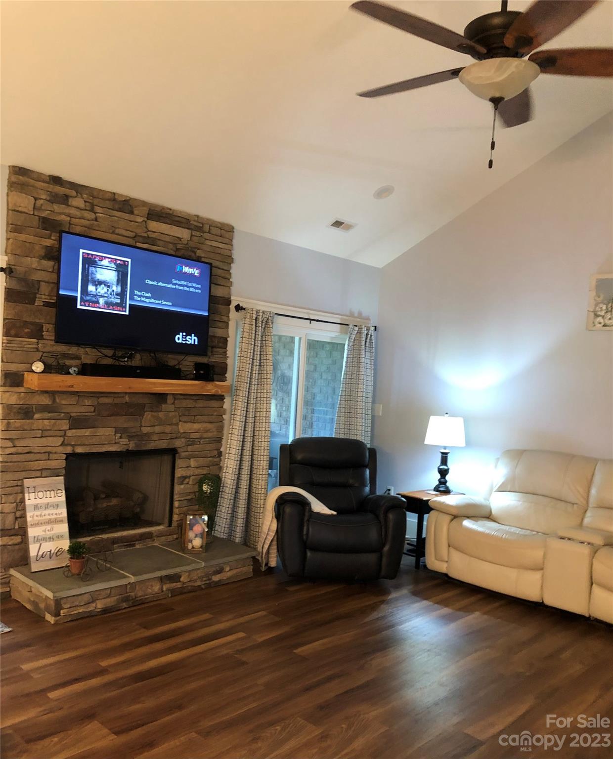 195 Thomas Road Clover, SC 29710 - Photo 14 of 45 a living room with furniture a fireplace and a flat screen tv