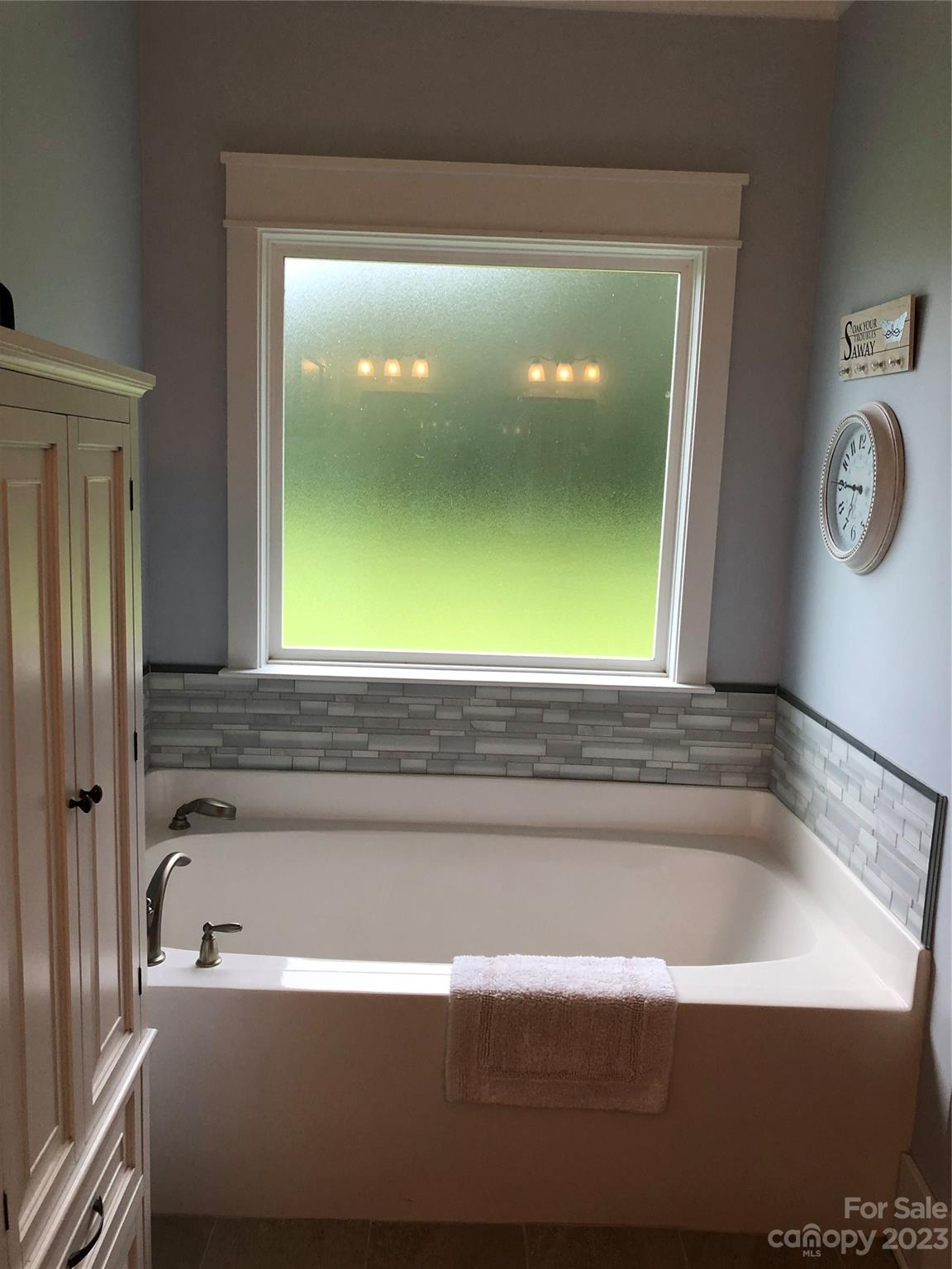 195 Thomas Road Clover, SC 29710 - Photo 19 of 45 a bathroom with a bathtub and a window