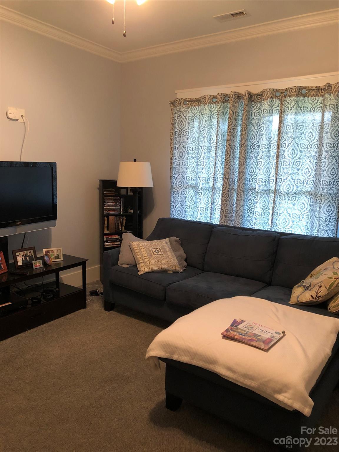 195 Thomas Road Clover, SC 29710 - Photo 27 of 45 a living room with furniture and a flat screen tv