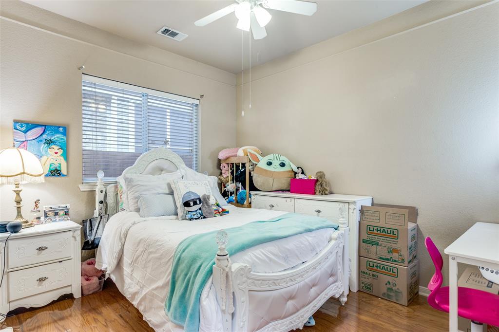 9117 Ripley Street Fort Worth, TX 76244 - Photo 25 of 31 Interior room featuring wood-finish flooring, light neutral-toned walls, and a ceiling fan