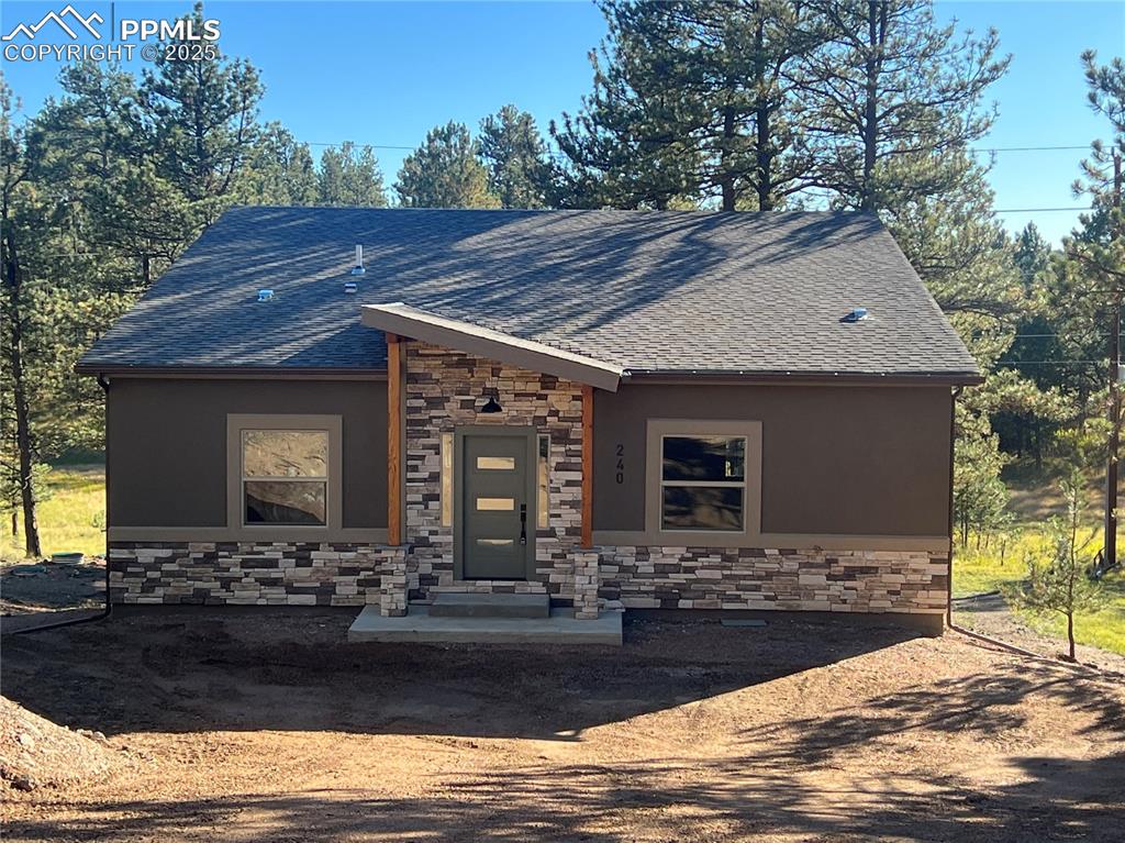 240 North Mountain Estates Road Florissant, CO 80816 - Photo 1 of 48 a front view of house with yard