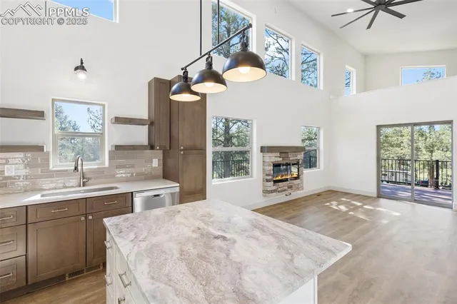 a spacious bedroom with a bed dresser and a window