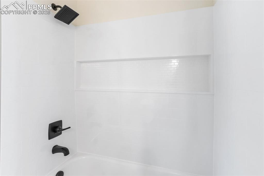 240 North Mountain Estates Road Florissant, CO 80816 - Photo 23 of 48 a bathroom with a shower