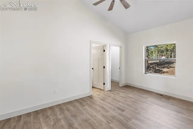 an entryway and a livingroom with wooden floor