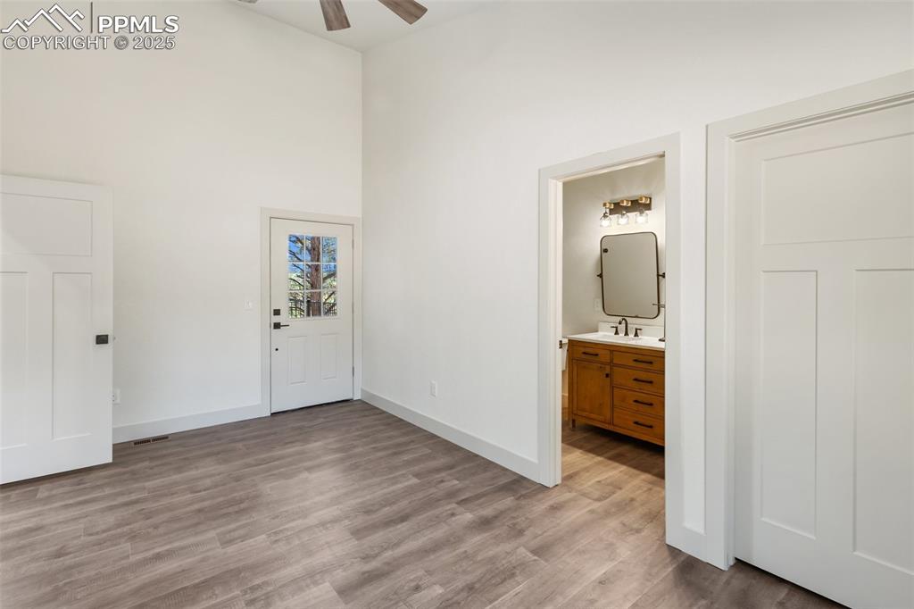 240 North Mountain Estates Road Florissant, CO 80816 - Photo 30 of 48 an entryway and a livingroom with wooden floor