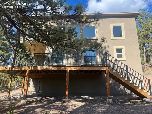 a view of a house with snow on the road