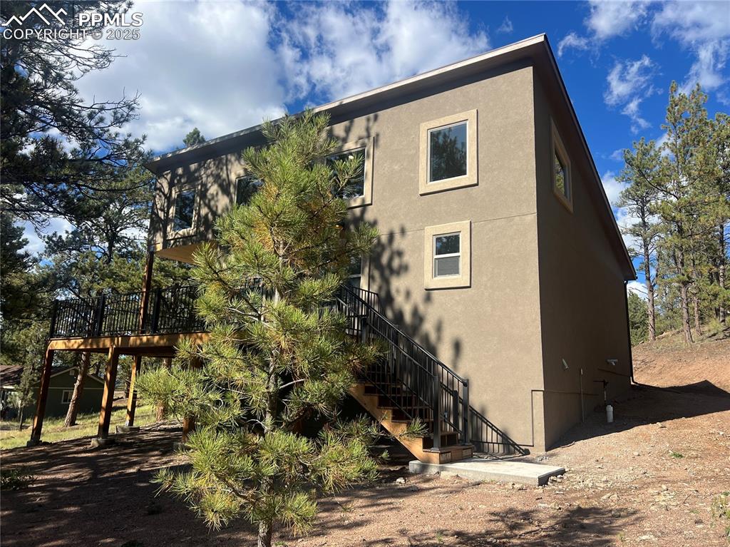 240 North Mountain Estates Road Florissant, CO 80816 - Photo 40 of 48 a view of a house with a yard