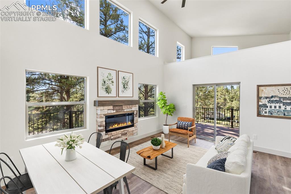 240 North Mountain Estates Road Florissant, CO 80816 - Photo 4 of 48 a living room with furniture large window and flat screen tv