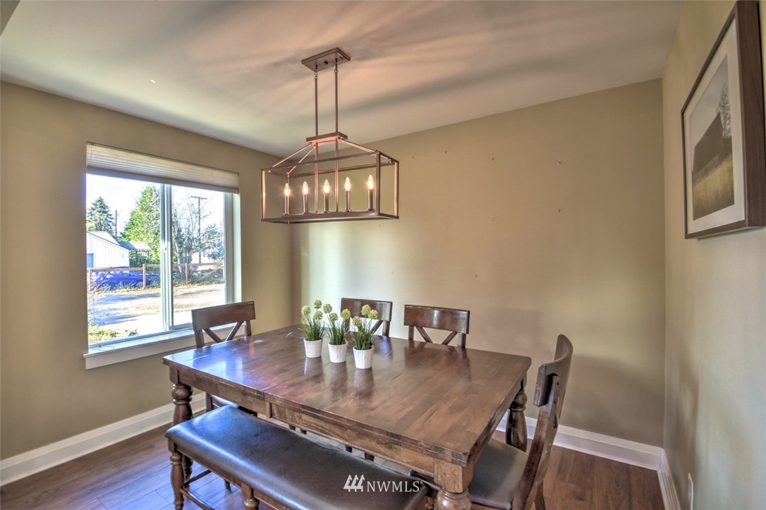 6131 Maytown Road Southwest Olympia, WA 98512 - Photo 13 of 39 a view of a dining room with a table and chairs