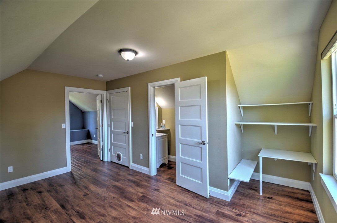 6131 Maytown Road Southwest Olympia, WA 98512 - Photo 23 of 39 a view of a hallway with wooden floor and closet