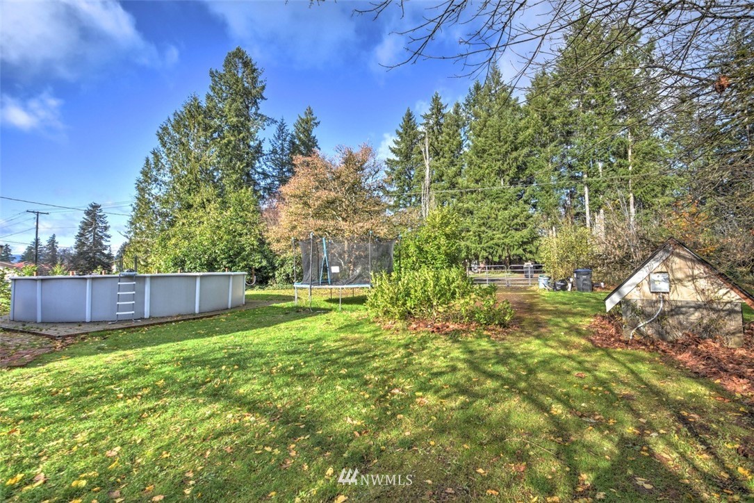 6131 Maytown Road Southwest Olympia, WA 98512 - Photo 31 of 39 a view of backyard with a small cabin