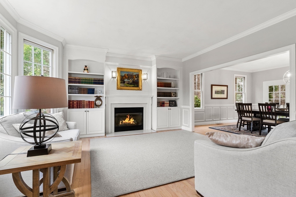 11 Barnside Road Boxford, MA 01921 - Photo 12 of 42 a living room with furniture a fireplace and a flat screen tv