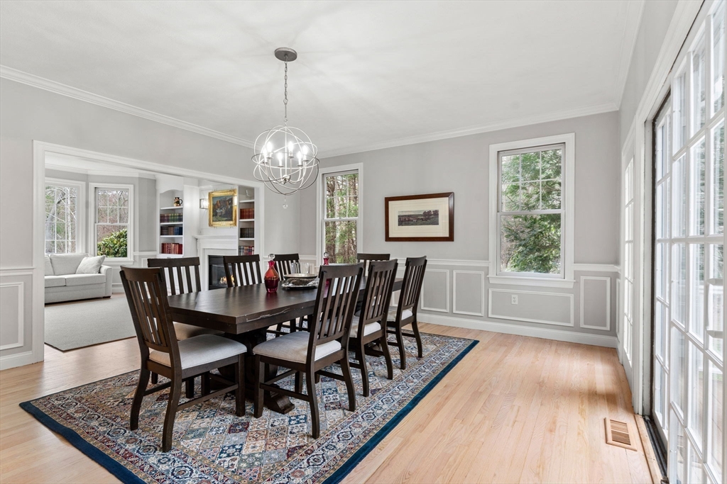 11 Barnside Road Boxford, MA 01921 - Photo 13 of 42 a view of a dining room with furniture a chandelier and wooden floor