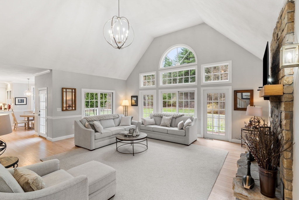 11 Barnside Road Boxford, MA 01921 - Photo 20 of 42 a living room with furniture fireplace and a large window