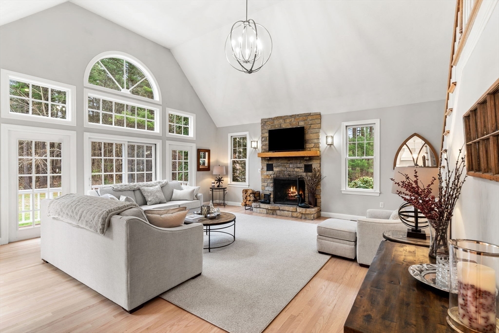 11 Barnside Road Boxford, MA 01921 - Photo 21 of 42 a living room with furniture a fireplace and a flat screen tv