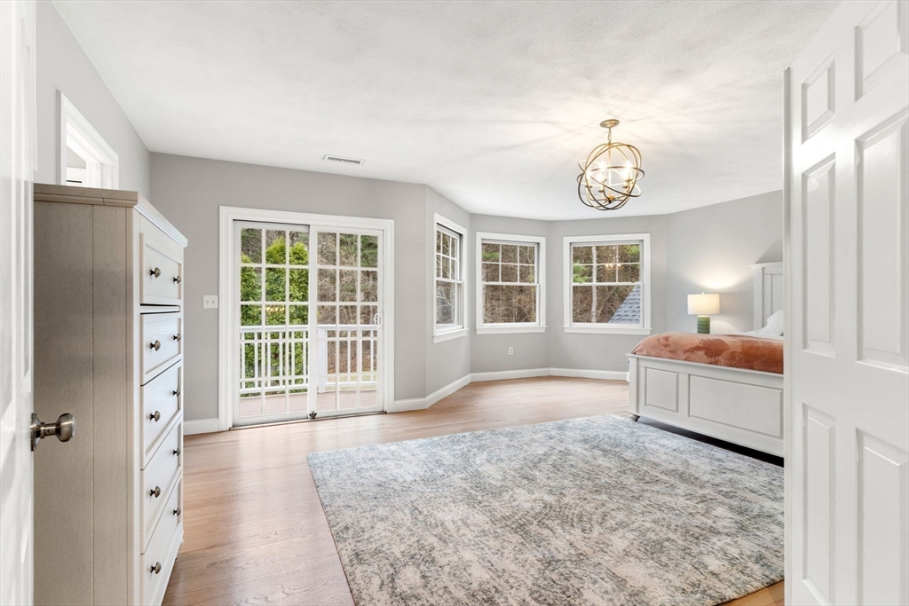 11 Barnside Road Boxford, MA 01921 - Photo 25 of 42 a spacious bedroom with a large bed and a window