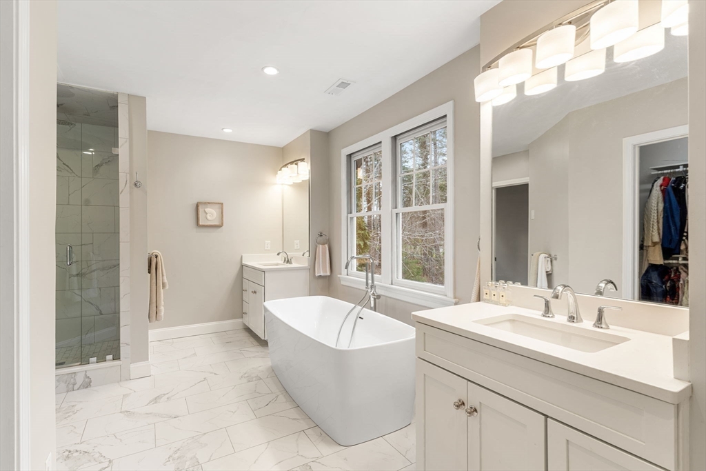 11 Barnside Road Boxford, MA 01921 - Photo 27 of 42 a bathroom with a tub sink and mirror