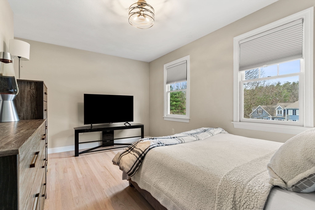 11 Barnside Road Boxford, MA 01921 - Photo 31 of 42 a bedroom with a bed and a flat screen tv