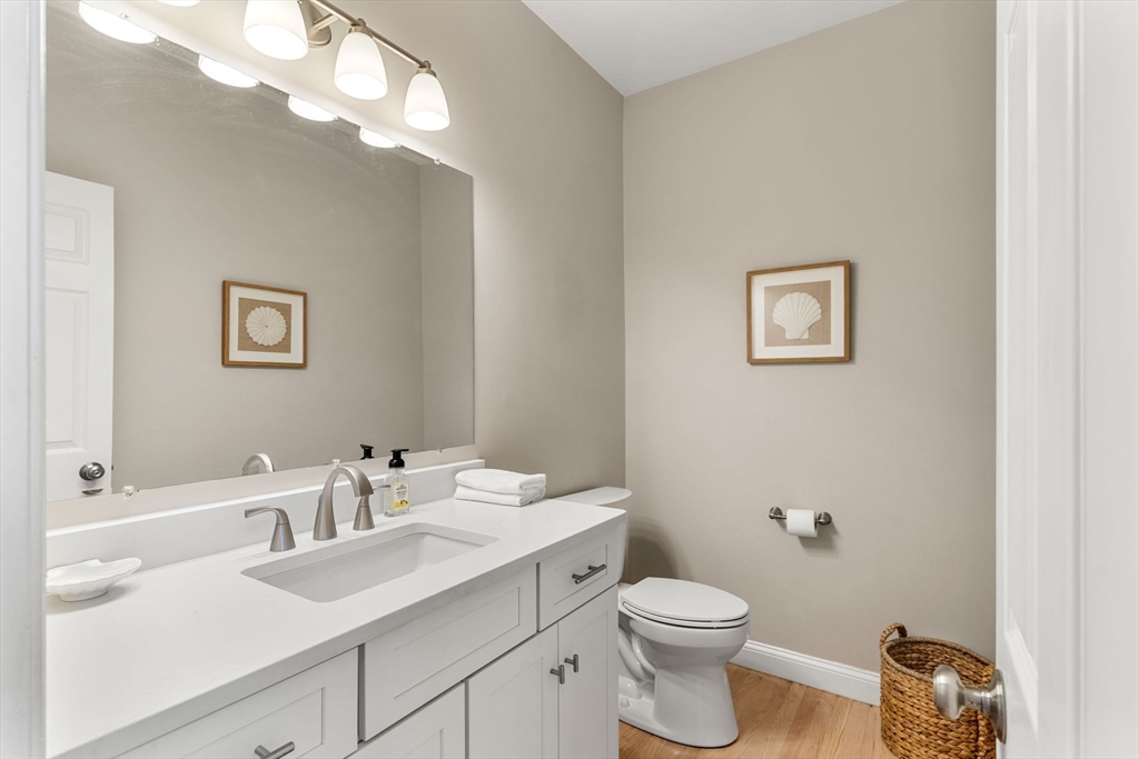 11 Barnside Road Boxford, MA 01921 - Photo 34 of 42 a bathroom with a toilet a sink and mirror
