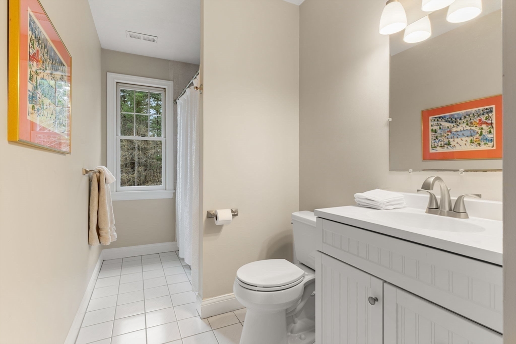 11 Barnside Road Boxford, MA 01921 - Photo 35 of 42 a bathroom with a toilet sink and mirror