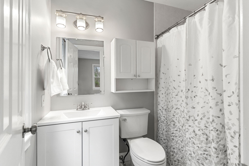11 Barnside Road Boxford, MA 01921 - Photo 36 of 42 a bathroom with a sink a toilet and shower