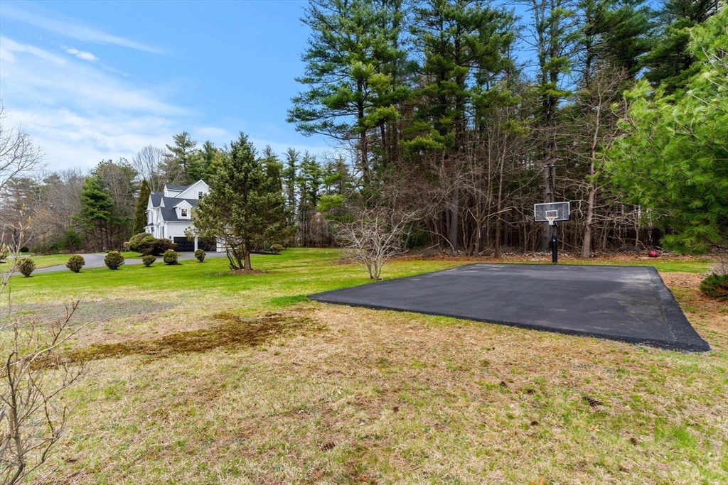 11 Barnside Road Boxford, MA 01921 - Photo 7 of 42 a view of a playground with basketball court