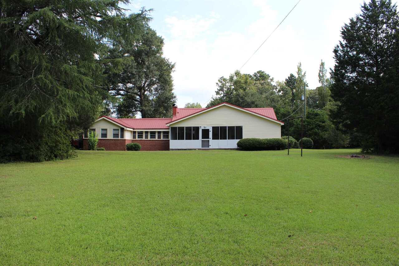 2827 Hamilton Road LaGrange, GA 30241 - Photo 1 of 1 a front view of a house with garden
