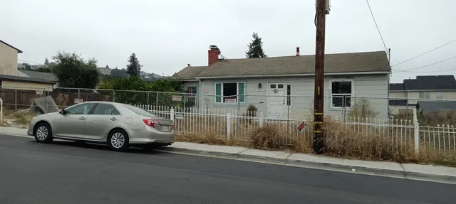 a car parked in front of a house