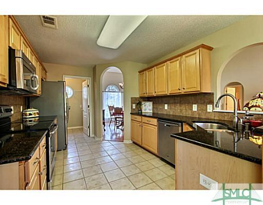 463 Copper Creek Circle Pooler, GA 31322 - Photo 7 of 25 Kitchen. New Granite Counters and Tile Flooring