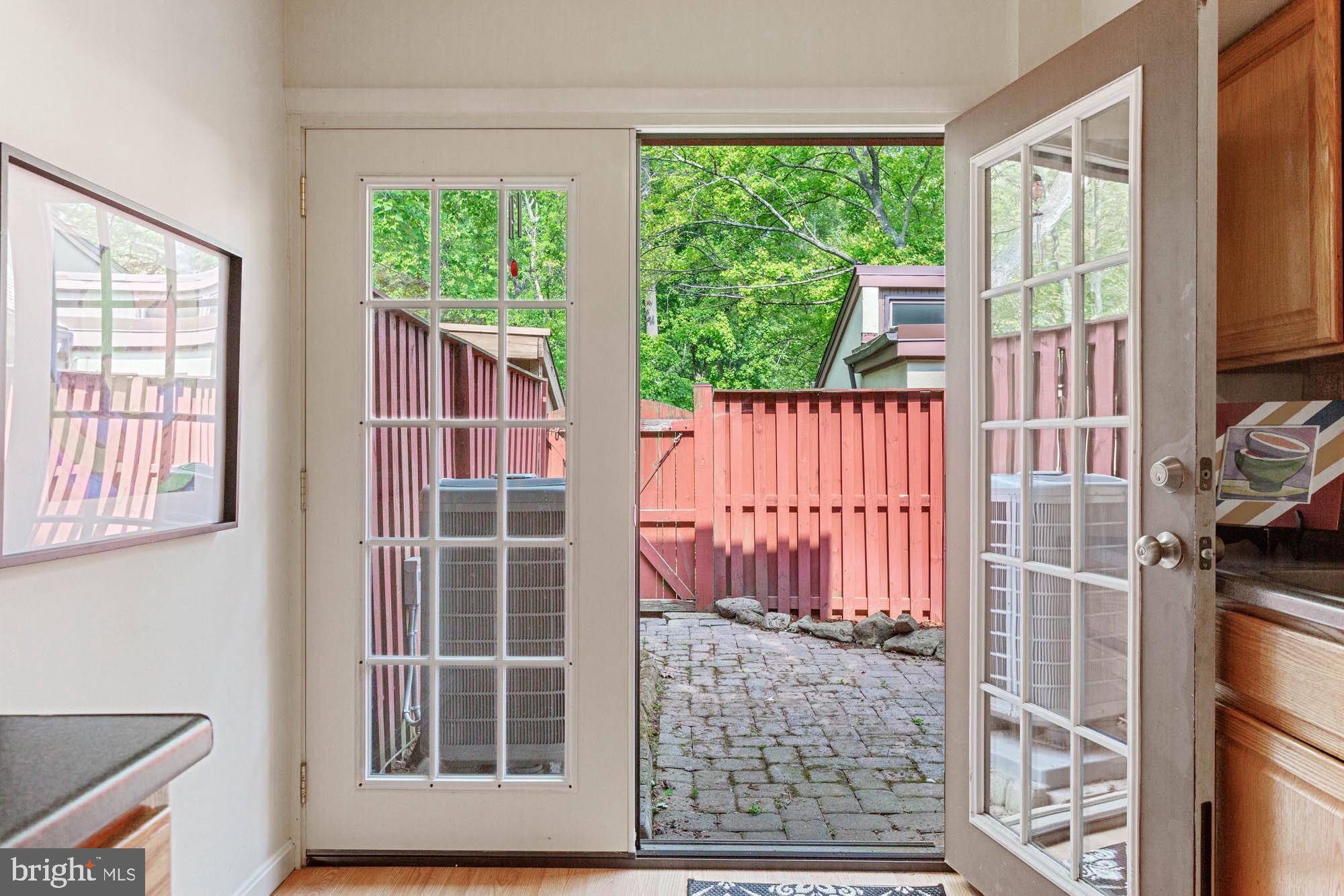 11241 Crystal Run, Unit B289 Columbia, MD 21044 - Photo 15 of 33 FRENCH DOORS TO BRICK PATIO & SMALL ROCK GARDEN