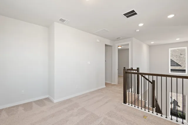 a view of hallway with a window