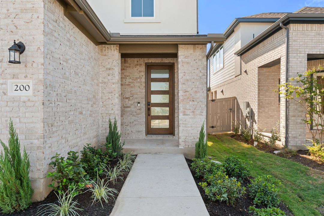 200 Brandywine Road Hutto, TX 78634 - Photo 3 of 39 a view of a pathway along the building