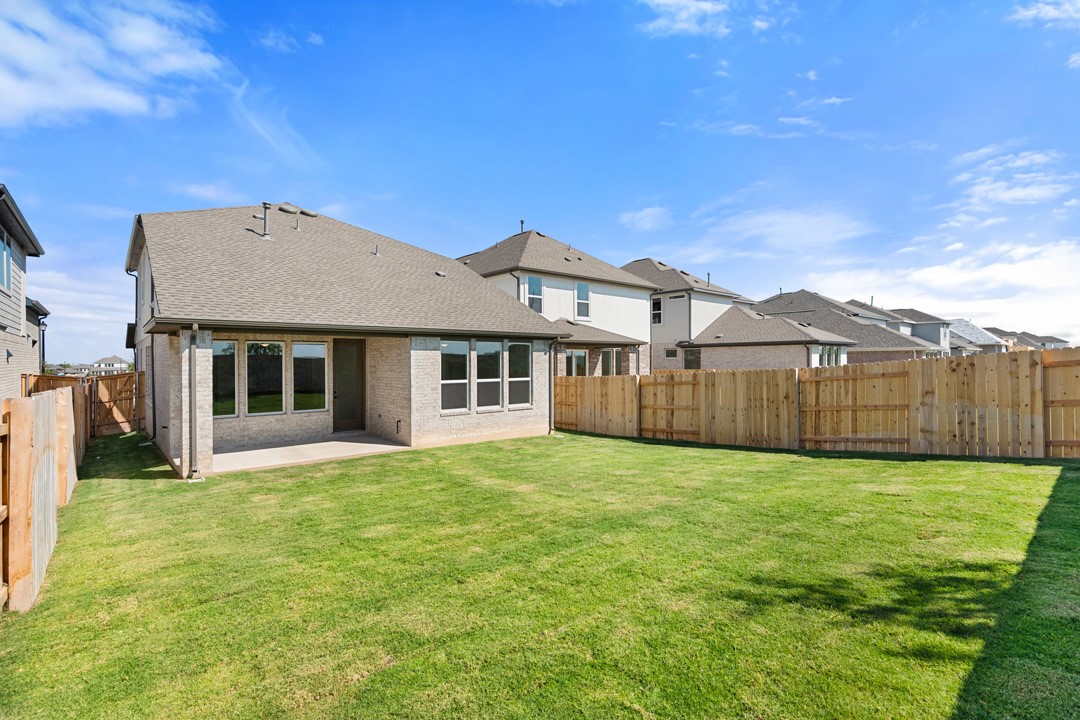 200 Brandywine Road Hutto, TX 78634 - Photo 38 of 39 a front view of a house with a yard and garage