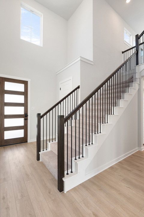 200 Brandywine Road Hutto, TX 78634 - Photo 5 of 39 a view of a hallway with wooden floor and stairs