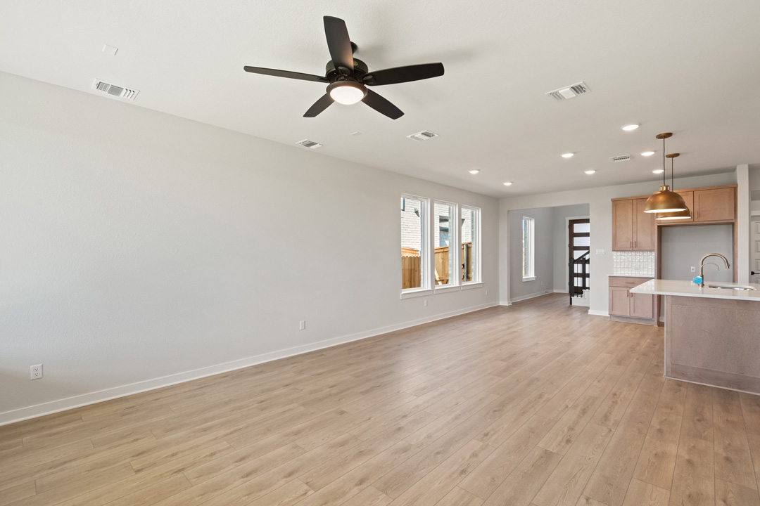 200 Brandywine Road Hutto, TX 78634 - Photo 10 of 39 a view of a livingroom with a ceiling fan and window