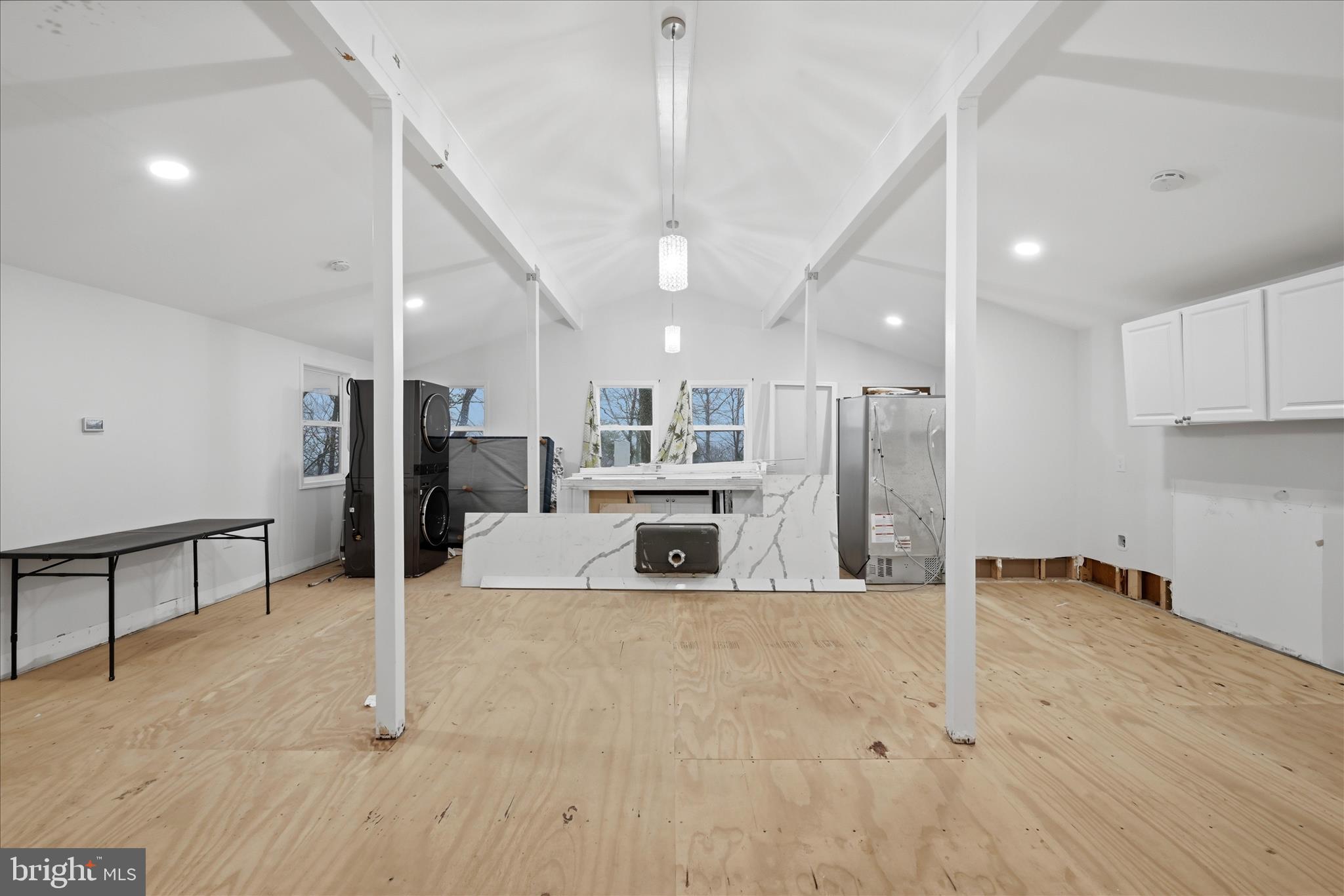 104 Inca Trail Winchester, VA 22602 - Photo 12 of 40 a view of a kitchen with refrigerator and a living room