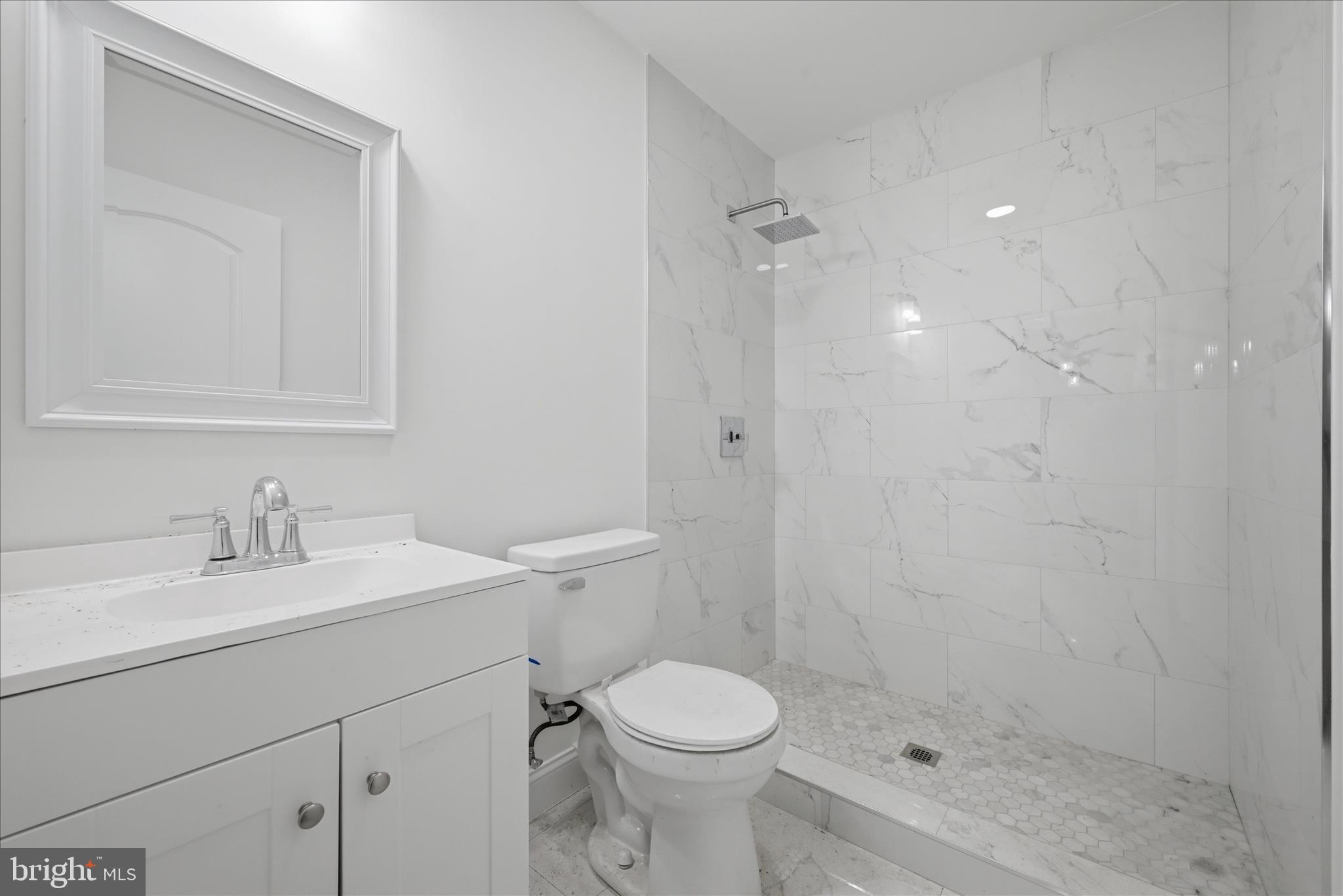 104 Inca Trail Winchester, VA 22602 - Photo 24 of 40 a bathroom with a sink a toilet and shower