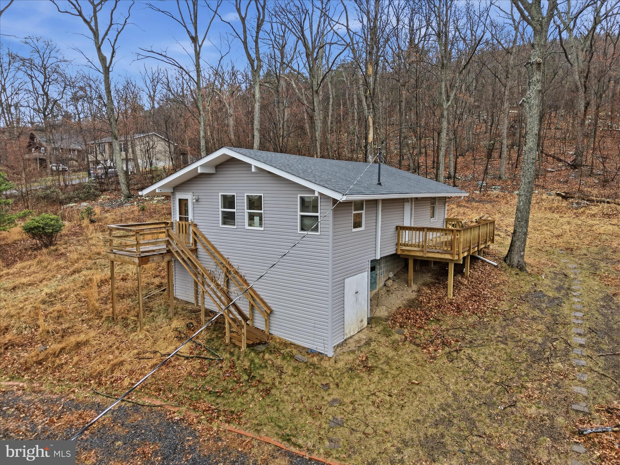 104 Inca Trail Winchester, VA 22602 - Photo 29 of 40 a white house with a large pool and wooden fence
