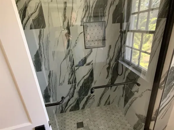 a view of a balcony with wooden floor and door