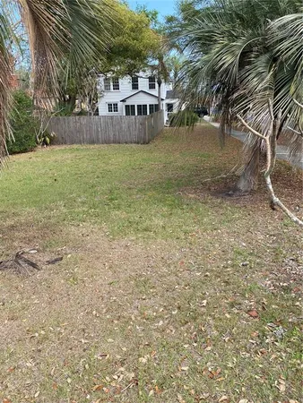 a view of a yard with an trees