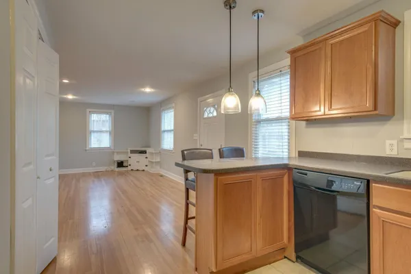 a kitchen with stove and cabinets