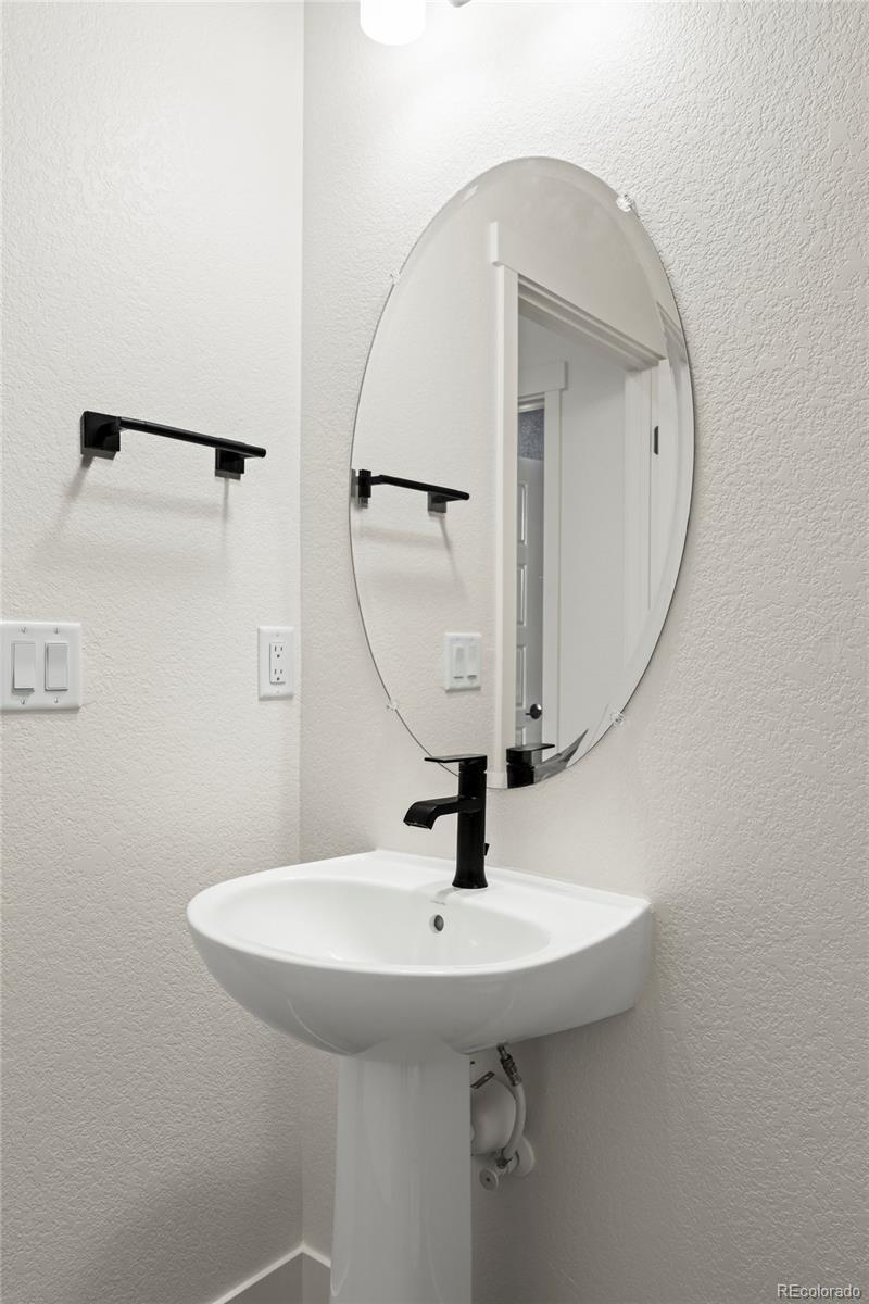4899 Daven Road Morrison, CO 80465 - Photo 15 of 27 a bathroom with a sink and mirror